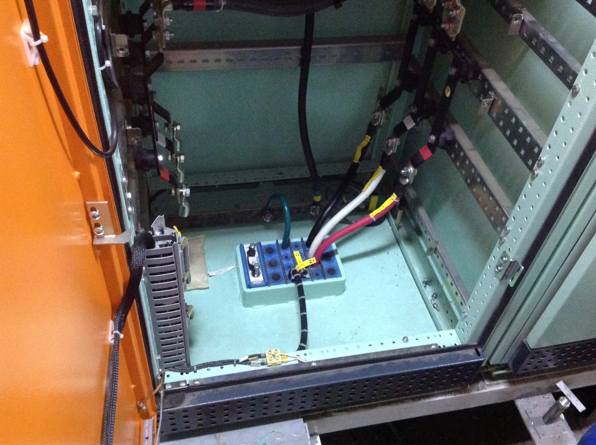 Interior of industrial panel showing wiring and cable entries