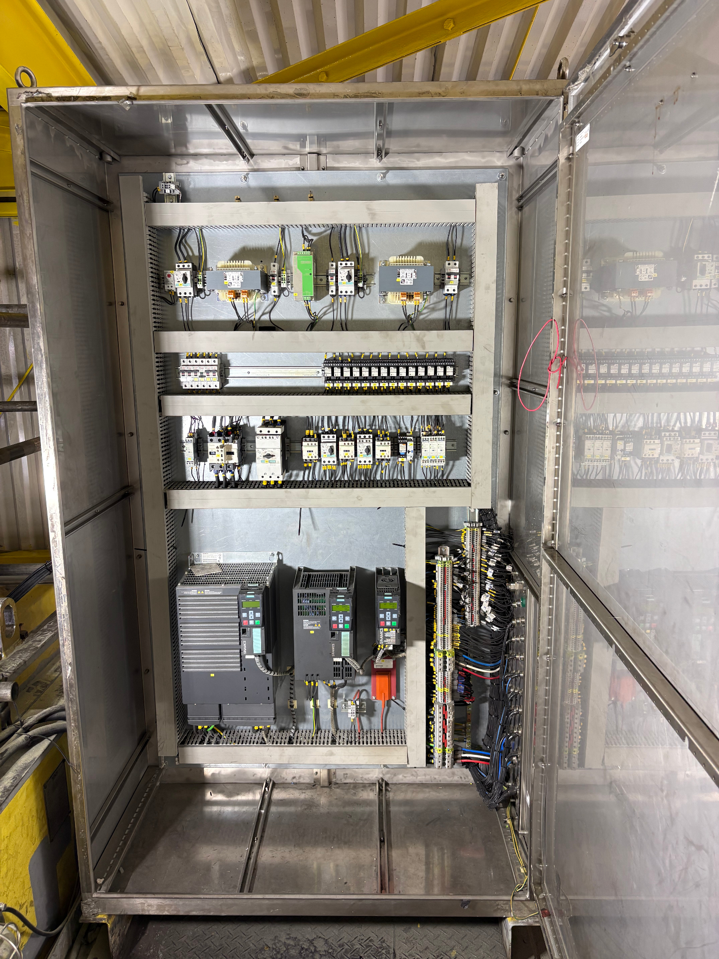 Interior of industrial control panel with protective devices and wiring