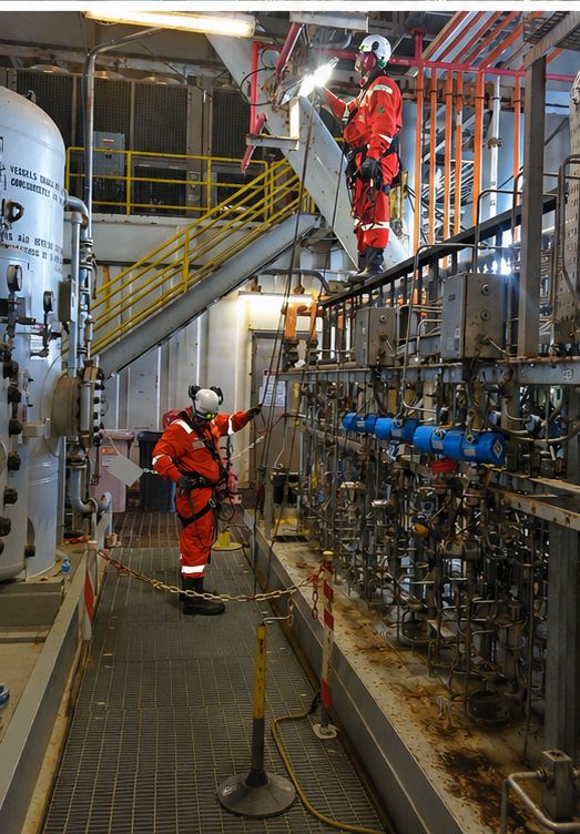 Inspectors verifying instrumentation on process skid